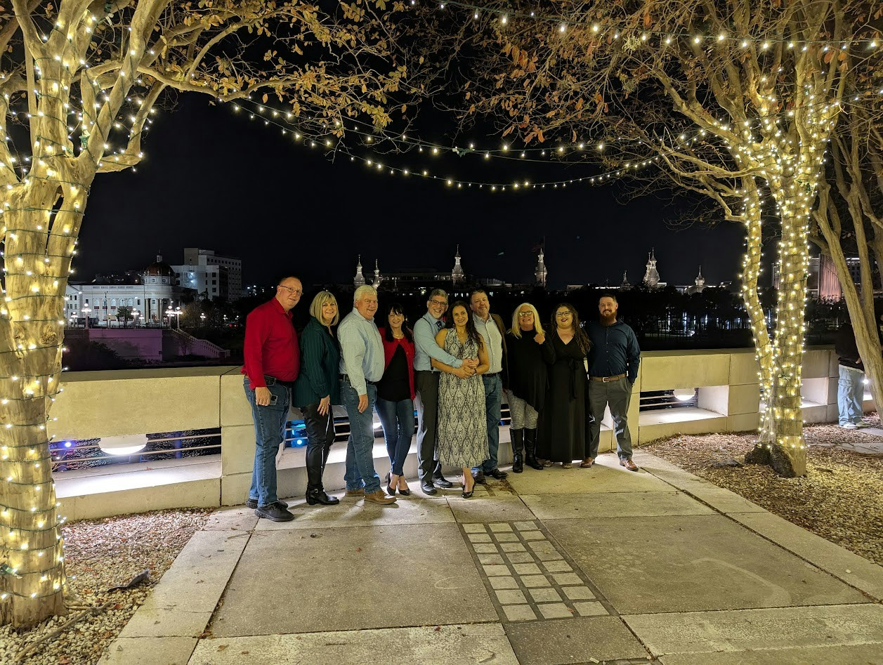 ANSWERFIRST MANAGEMENT TEAM AND SPOUSES ENJOYING A HOLIDAY DINNER IN DOWNTOWN TAMPA, FL