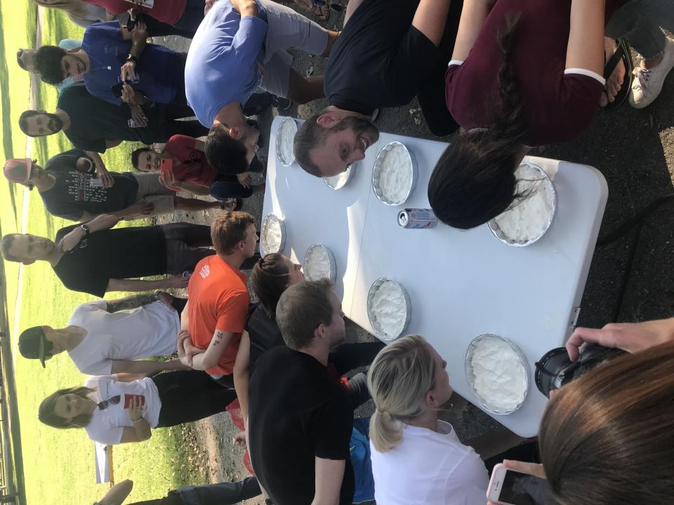 Pie eating contest at company BBQ