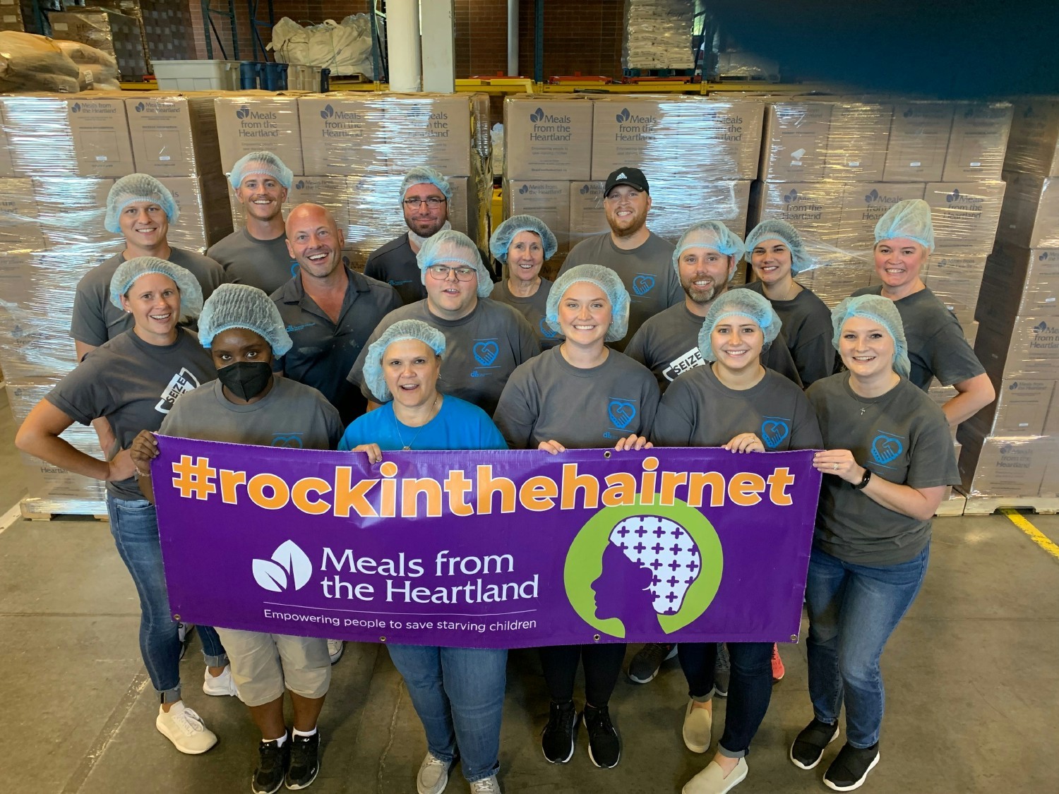 Members packaged meals to help feed children around the world. Giving back is a vital part of DLL’s culture. 