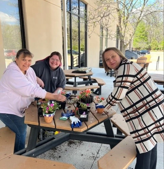 Happy May Day! Members celebrated by planting flowers. s. 