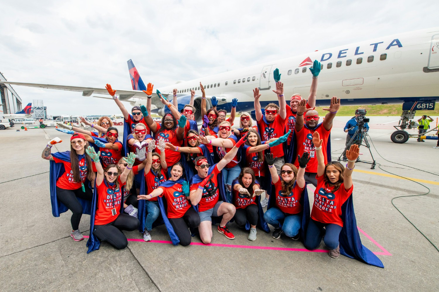 Delta Vacations completes to a pull a 757 jet  to support the American Cancer Society. 