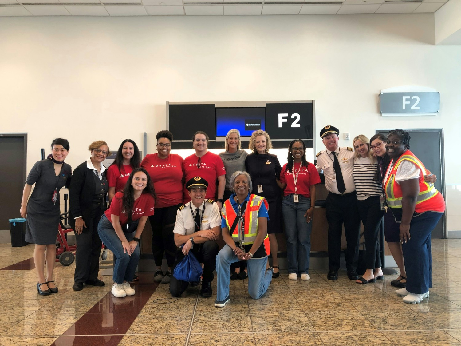 Delta Vacations people supporting Wings for All, a program that helps ease travel anxiety for people with disabilities.