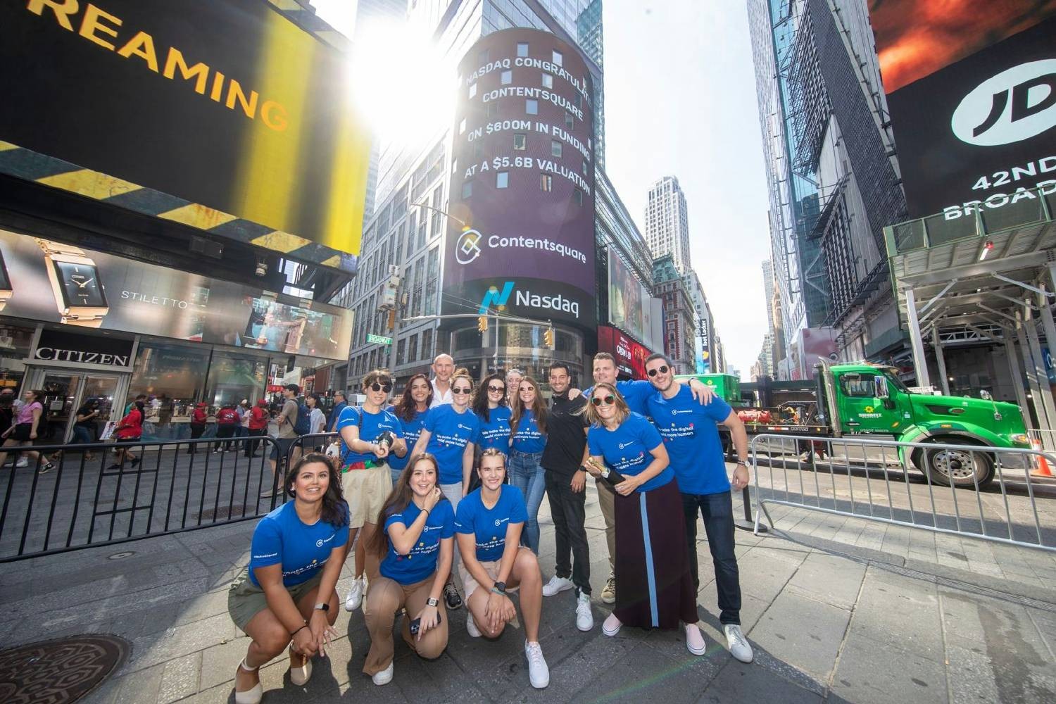 Employees celebrate our $600M series F funding outside the Nasdaq stock exchange