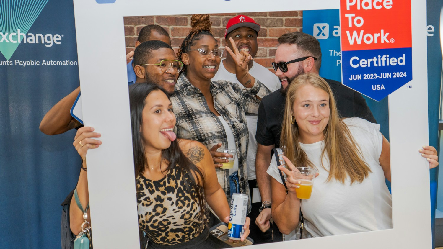 AvidXchange teammates wear big smiles as they celebrate being named a Great Place to Work in 2022. 