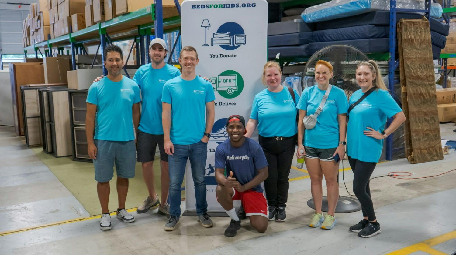 AvidXchange teammates volunteer at Beds for Kids, an organization making sure kids have a warm place to sleep. 