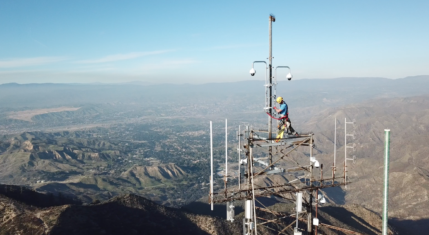 One of our infrastructure technicians installs a fire camera, used to detect the presence of wildfires through Calif. 