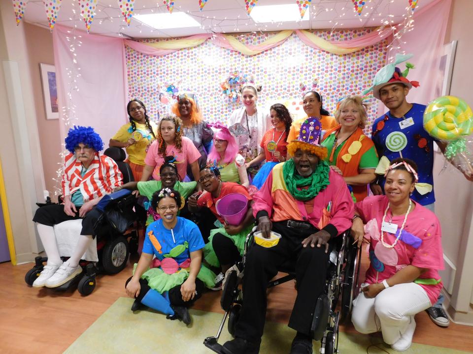 Memory Care unit staff and residents go all out in creating a Candy Land theme for the annual Gurwin Masquerade, winning them First Prize!
