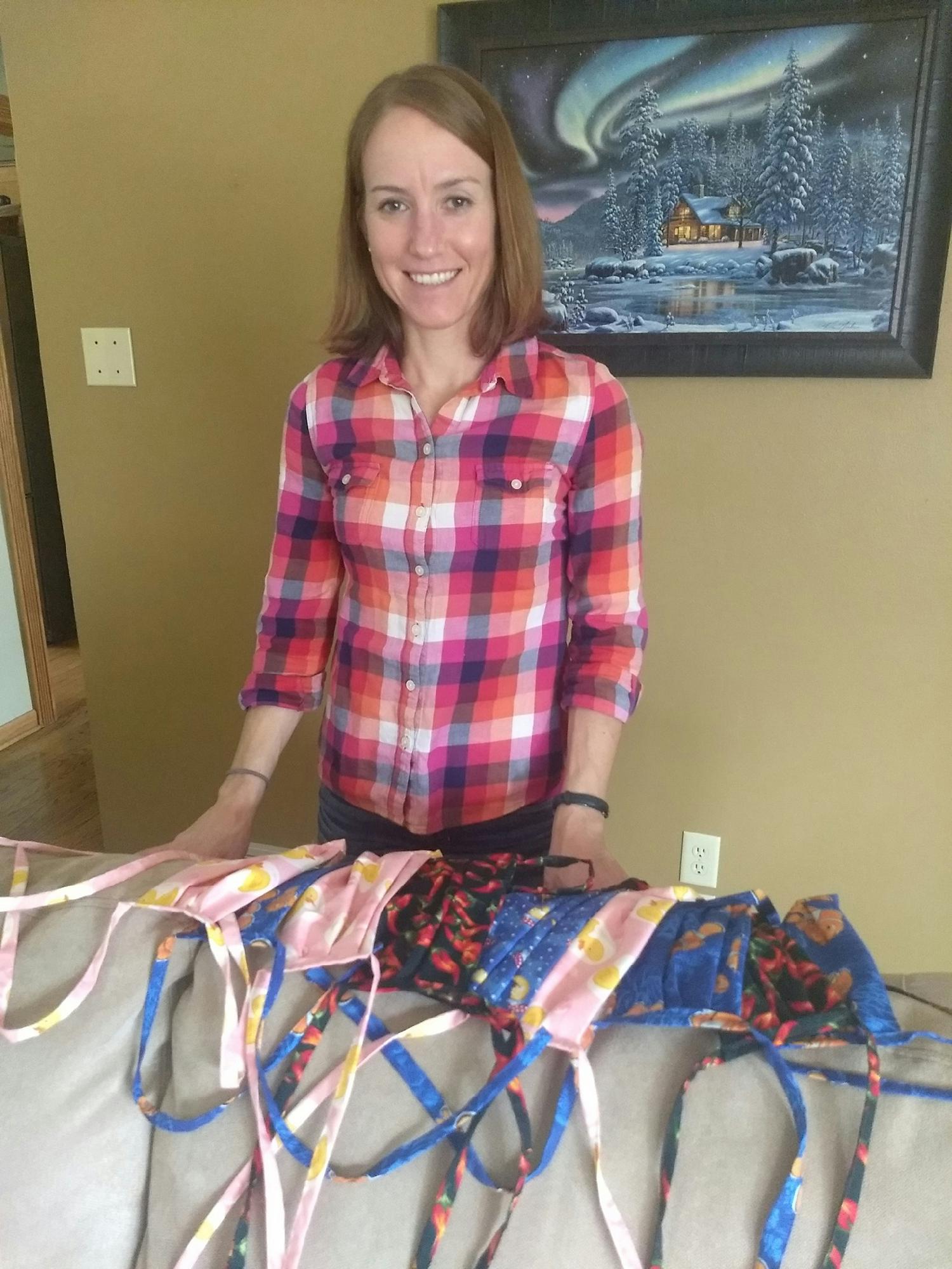 Employee making face masks for health care workers and friends.