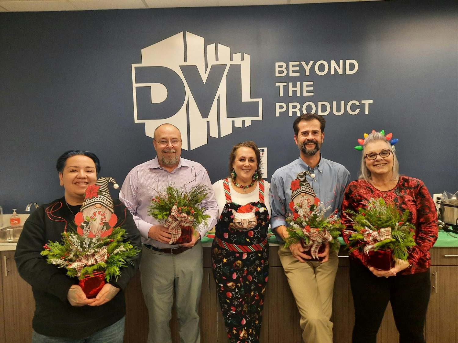 Proud winners of our annual holiday potluck lunch in our Centennial CO location where they competed for festive flowers.