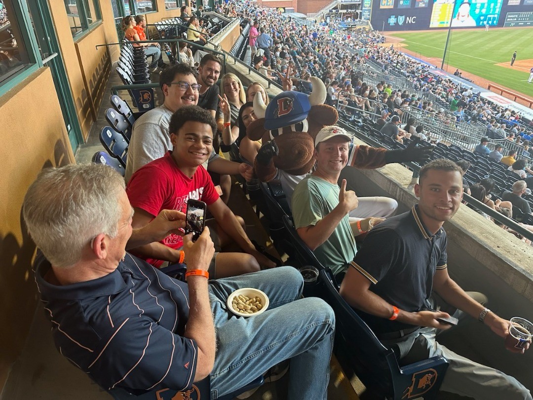 The IAT trainee class rallies for a Durham Bulls game.