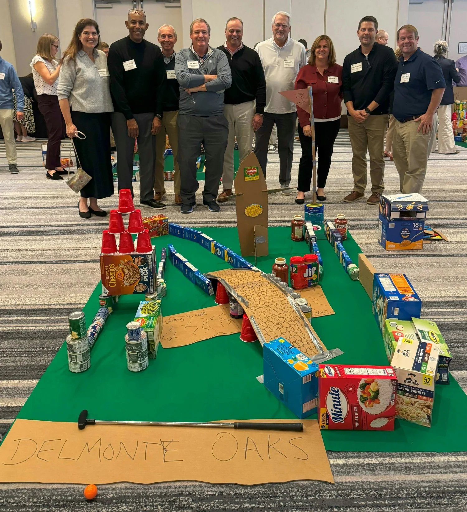 IAT leaders competed in a mini-golf team-building activity to benefit the charity Nourishing Hope. 