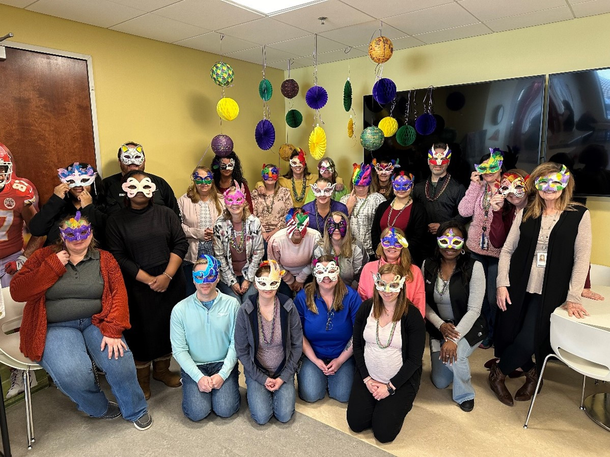 Celebrating Mardi Gras at IAT Insurance Group's Kansas City office.