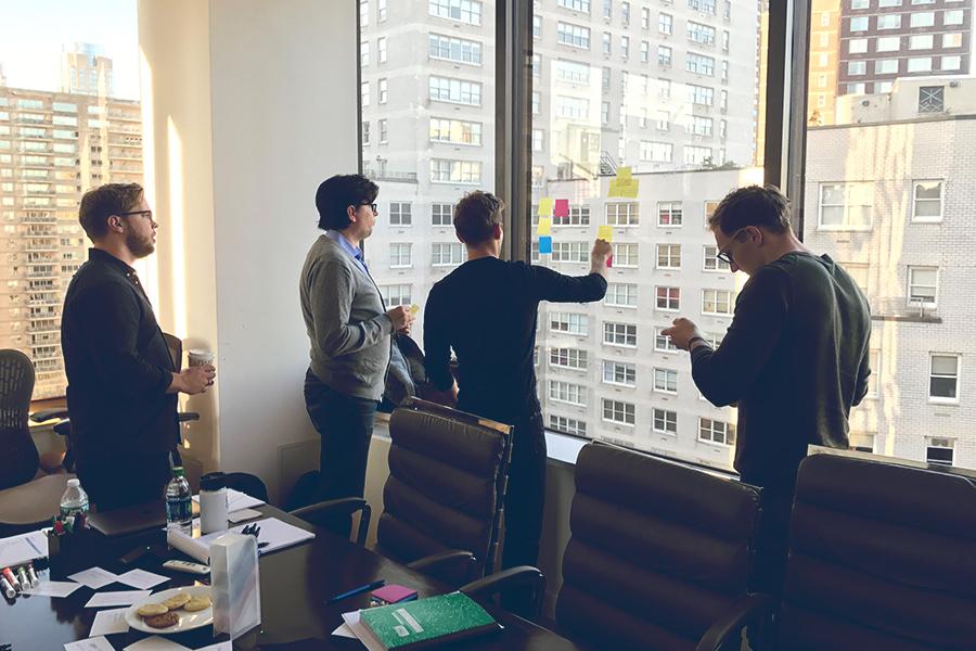Laurel Road employees brainstorming in the New York office