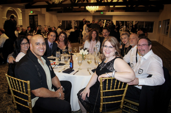 Great shot of the team patiently waiting for their food at the Annual Awards Night. 