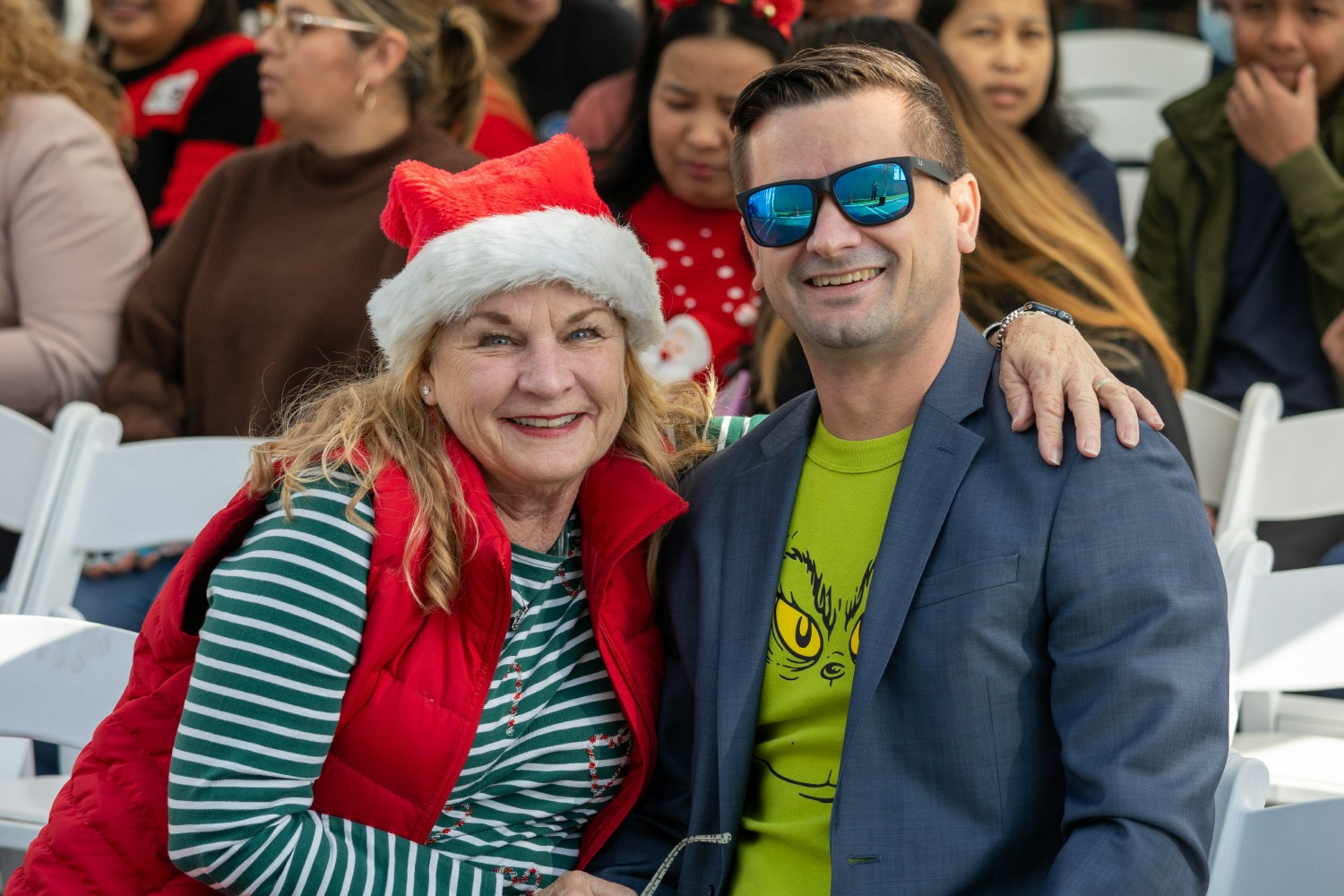 Employee Recognition & Holiday celebration - management enjoying presentation
