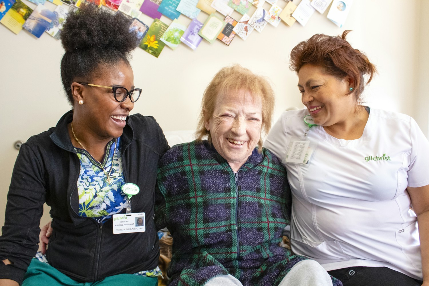 Gilchrist hospice team members and a Gilchrist laugh together while getting ready for lunch.