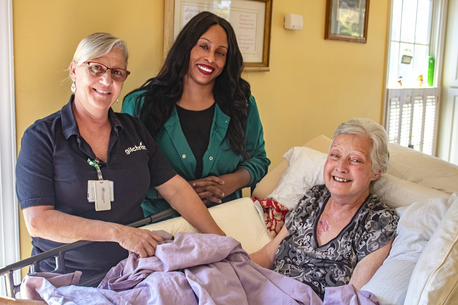 A Gilchrist hospice nurse and hospice aide help a patient maintain her beloved family time at home. 