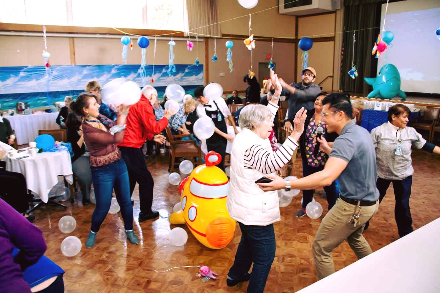 Staff and resident party at Canterbury Woods in Pacific Grove