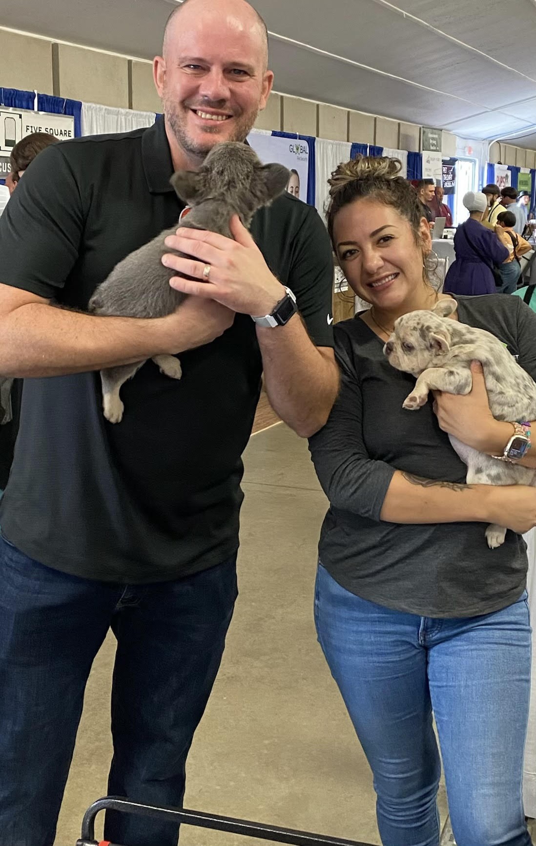 Team members meeting with multiple clients and their puppies at an Indiana event this fall.