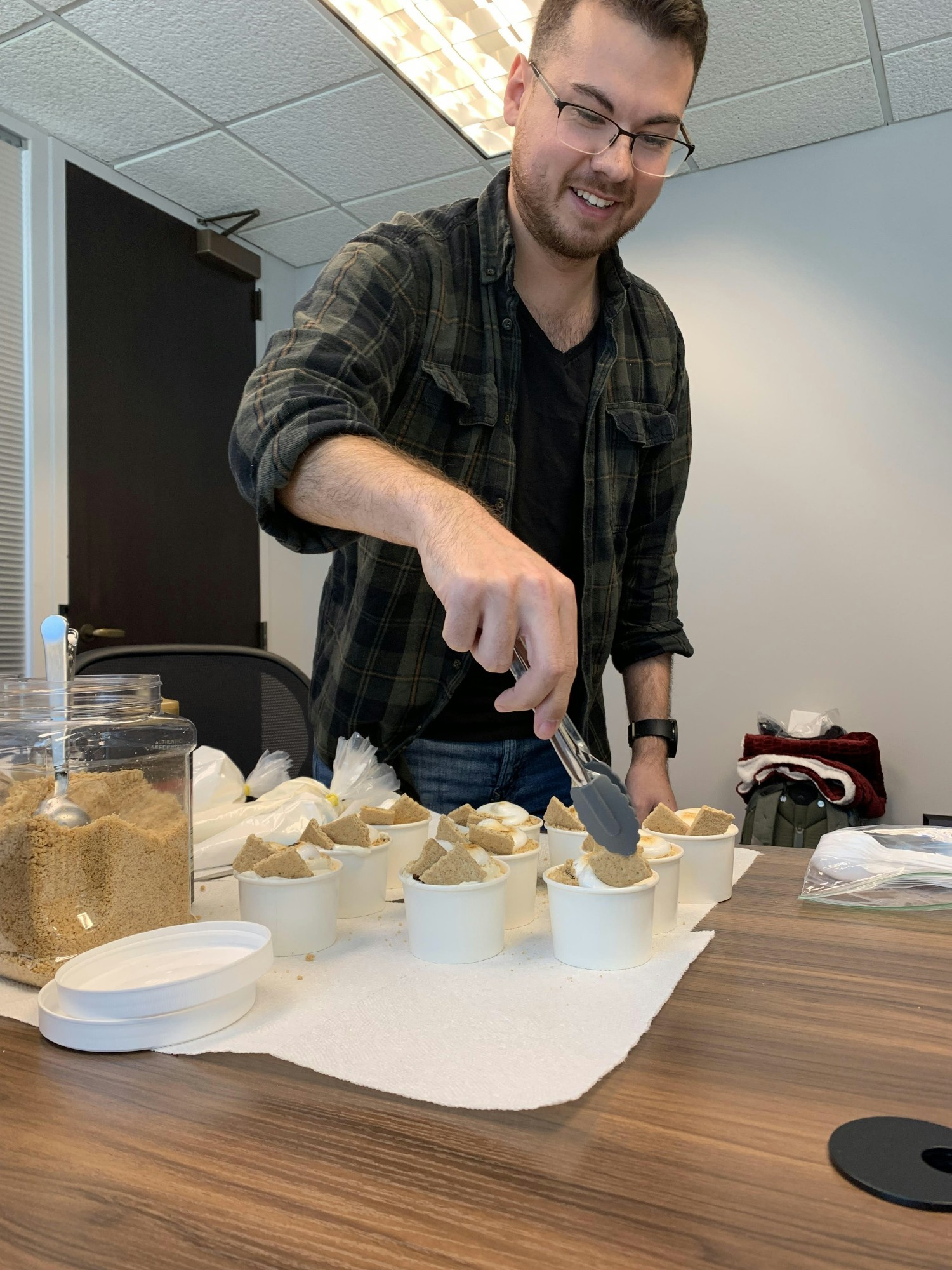 TPP team member prepares dessert from his family's locally owned business at a team luncheon.