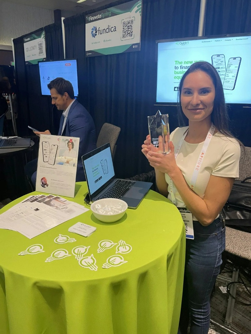 QuickFi executive, Jillian Munson, at the QuickFi booth at Finovate.