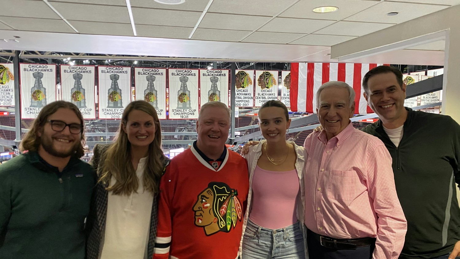 Liberty Advisor Group brings its employees together quarterly for learning and fun. A team at a Chicago Blackhawks game.