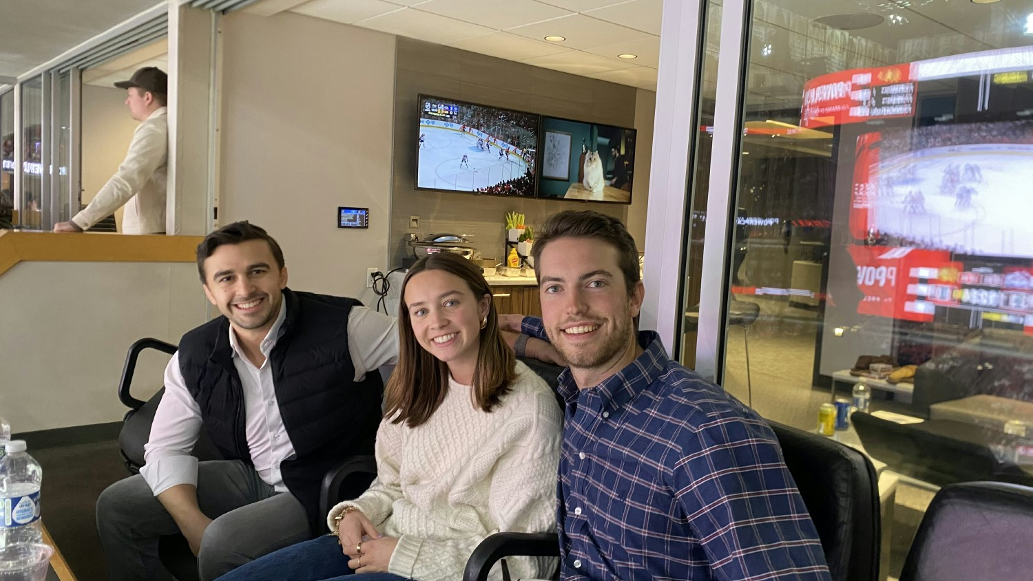 Liberty Advisor Group brings its employees together quarterly for learning and fun. A team at a Chicago Blackhawks game.