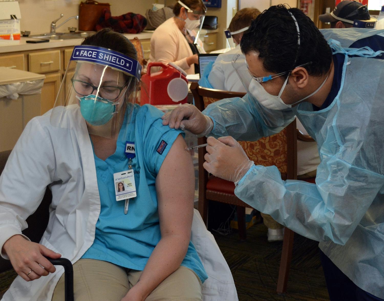 Team member receives one of the first COVID-19 vaccines.