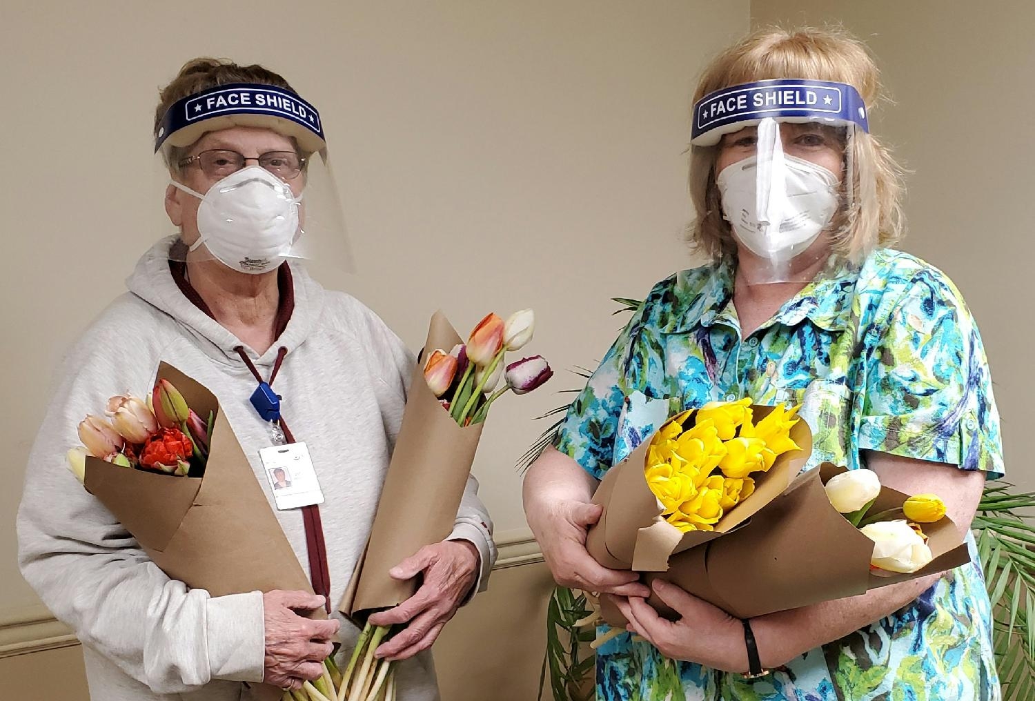 Team members raise money for flowers for residents.