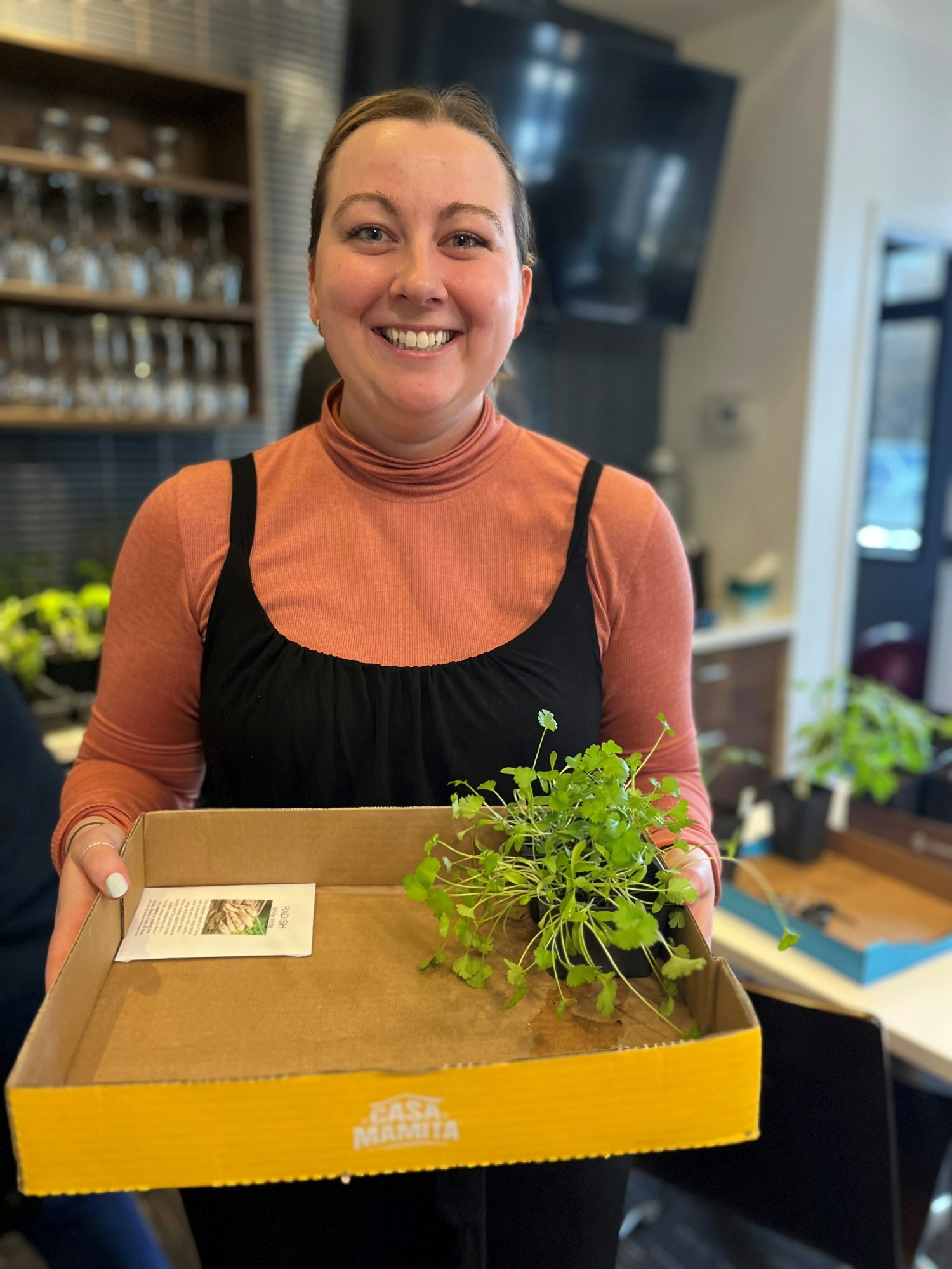 Allie Johnston from our People & Culture team makes a purchase at the WesleyLife plant sale. 