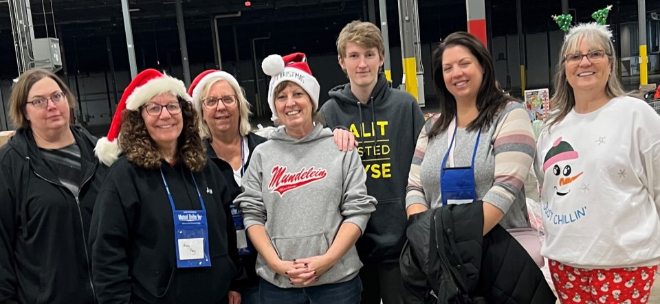 Volunteering at Catholic Charities warehouse - gift collection & distribution