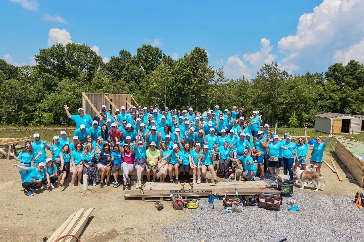 The Stand Out For Good family takes a moment to celebrate another successful homebuilding with Habitat for Humanity!
