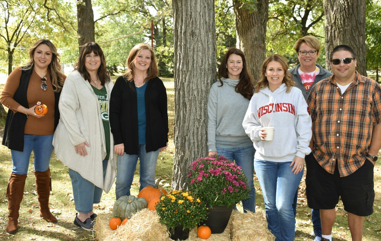 Team members enjoying a beautiful day outside at our annual fall festival for employees and their families.