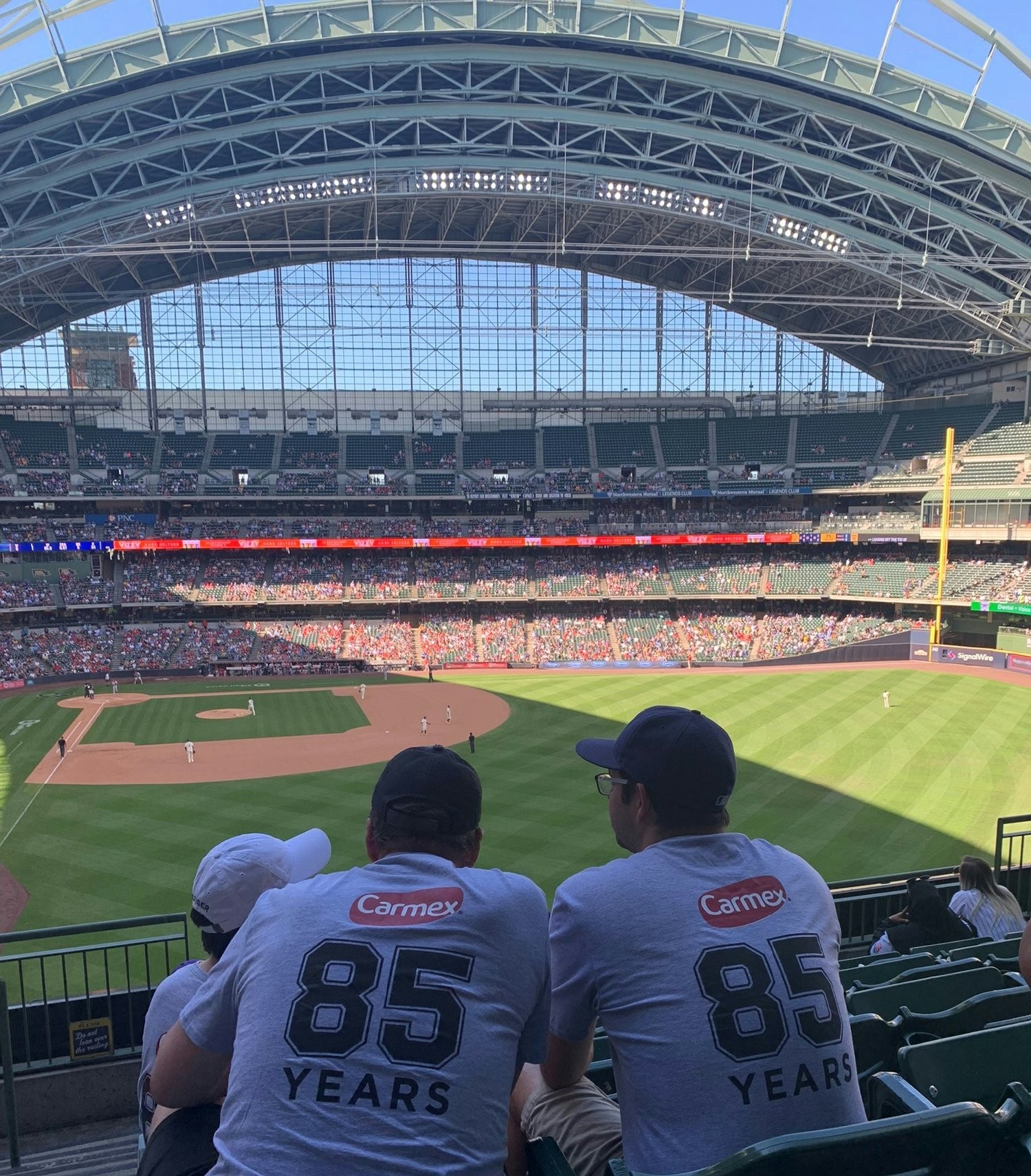 Team members enjoying our annual summer event at a Milwaukee Brewers baseball game.
