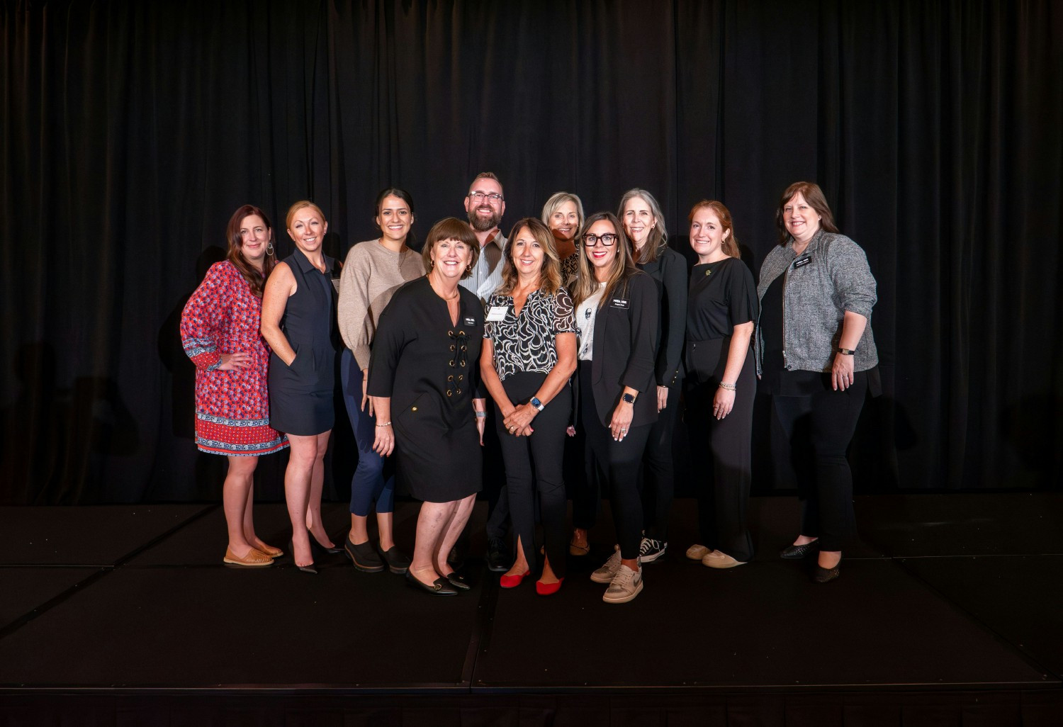 A picture of staff members celebrating the Women to Women (W2W) event, where female leaders attend and celebrate. 