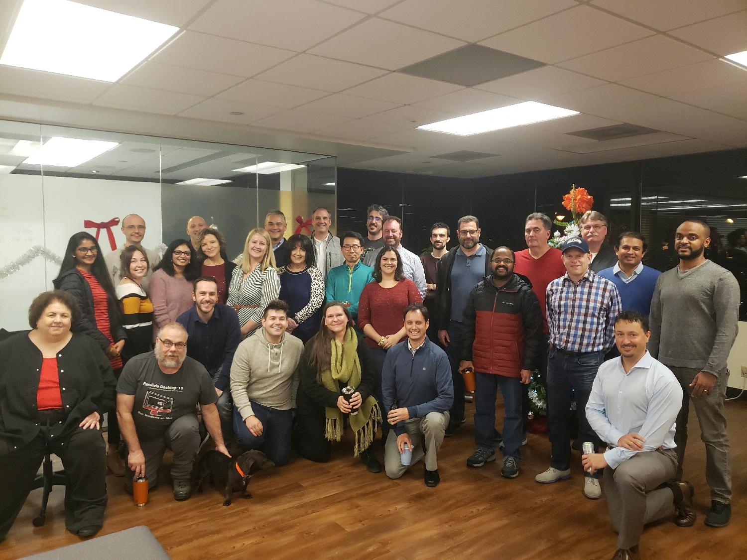 Our US team poses at our annual Virtuosity holiday party.