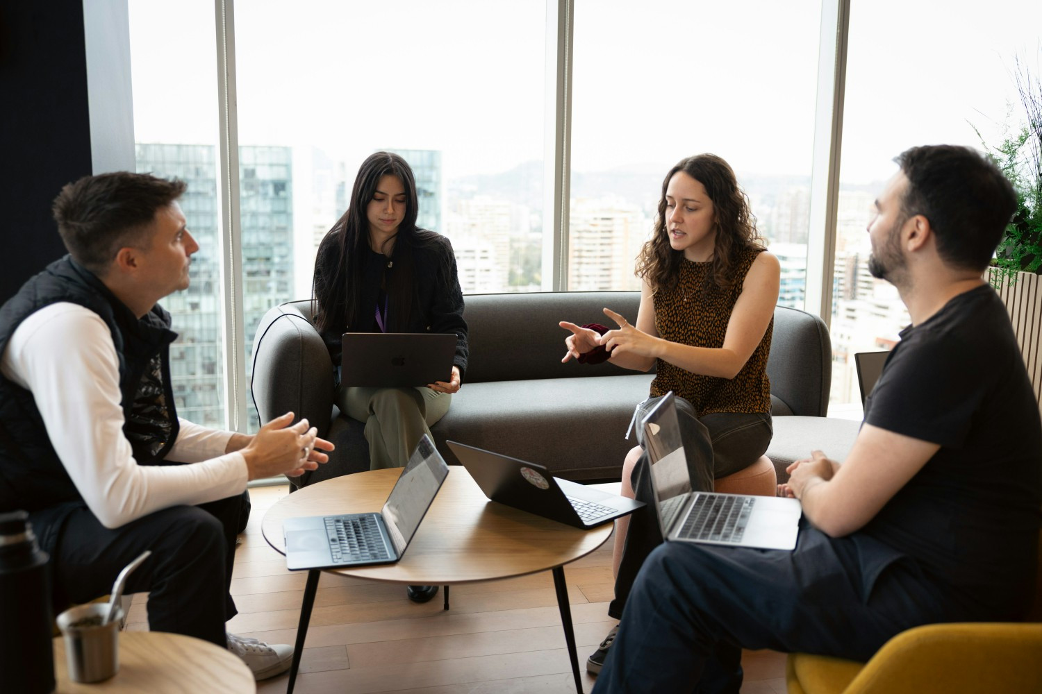 The team coming together to share ideas and collaborate.
