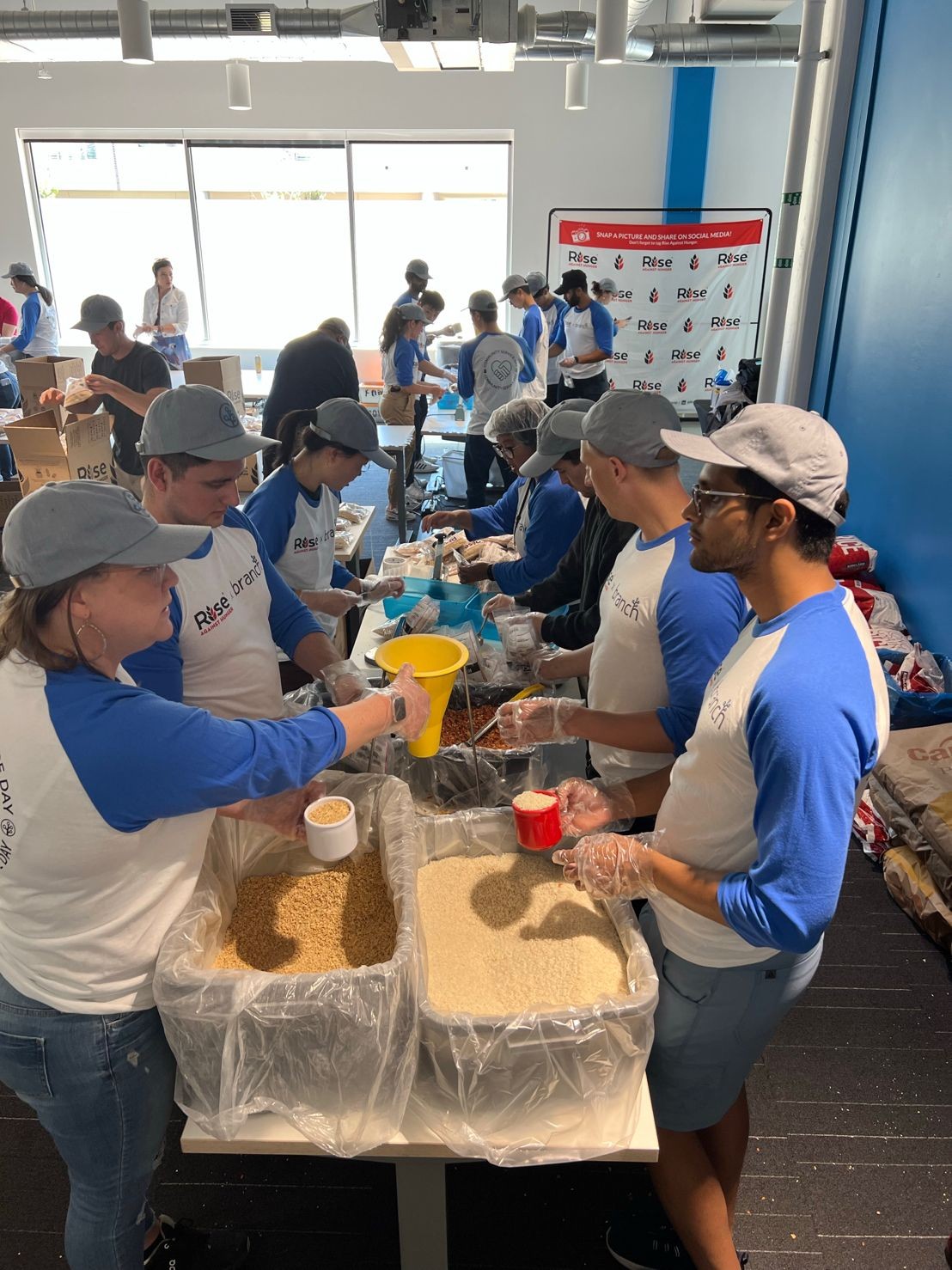 Branch Intern Service Day. Interns and Volunteers assembled 10,000 meals to combat global hunger