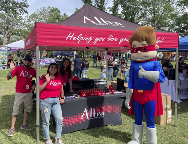 Employees and Cash volunteering at the Dia Del Nino festival in Tyler, TX.