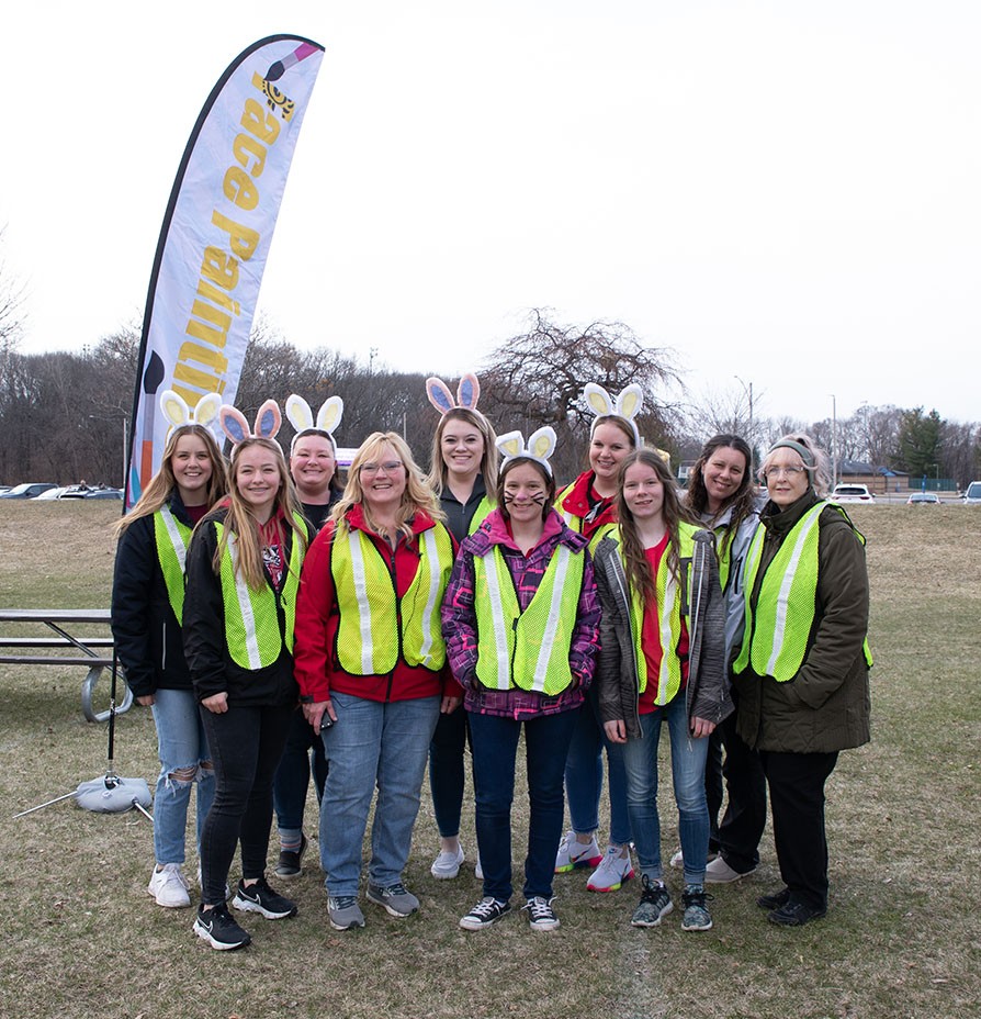 Group of employees volunteering at the annual community Easter egg hunt.