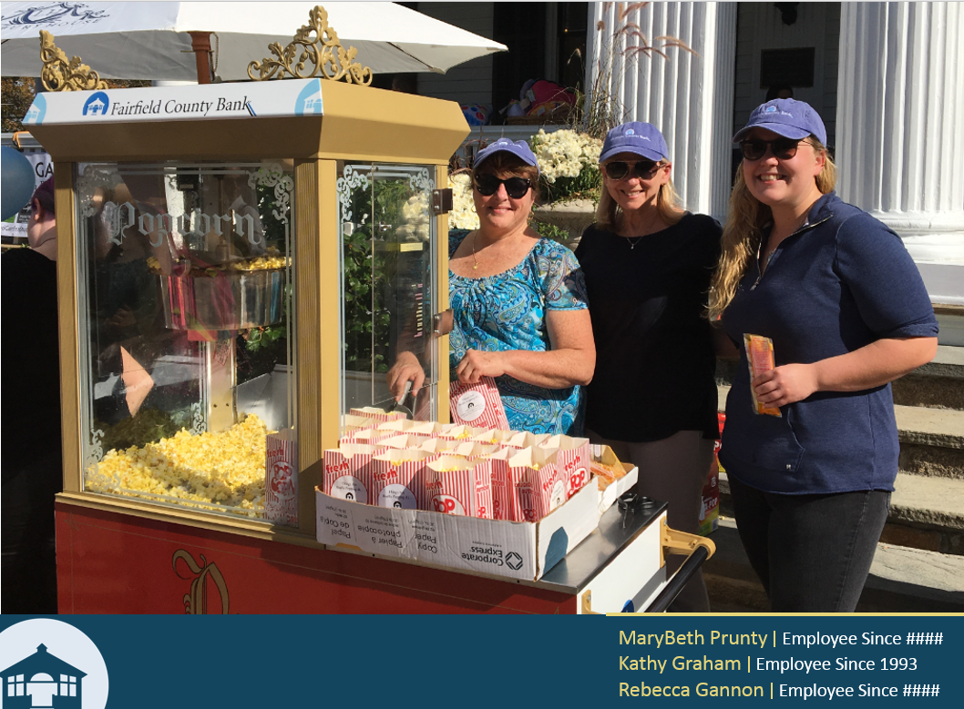 Popping in to help:  Employees popping corn for a community event.