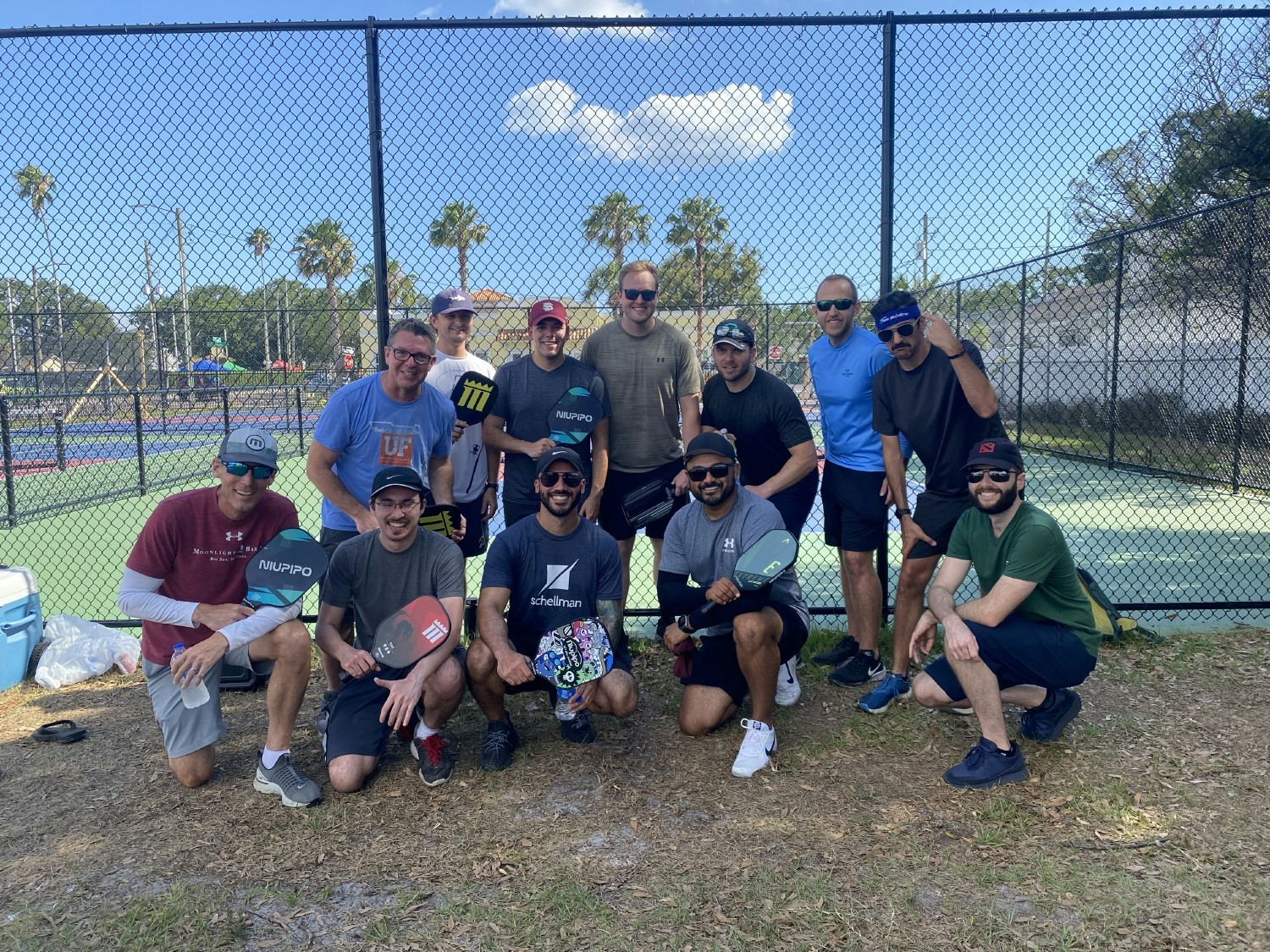 Our Tampa pickleball team gets together outside of work to relax- and a little friend competition.