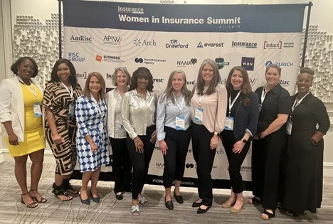 Associates collaborating at the Insurance Business America, Women in Insurance Summit in Atlanta, GA.