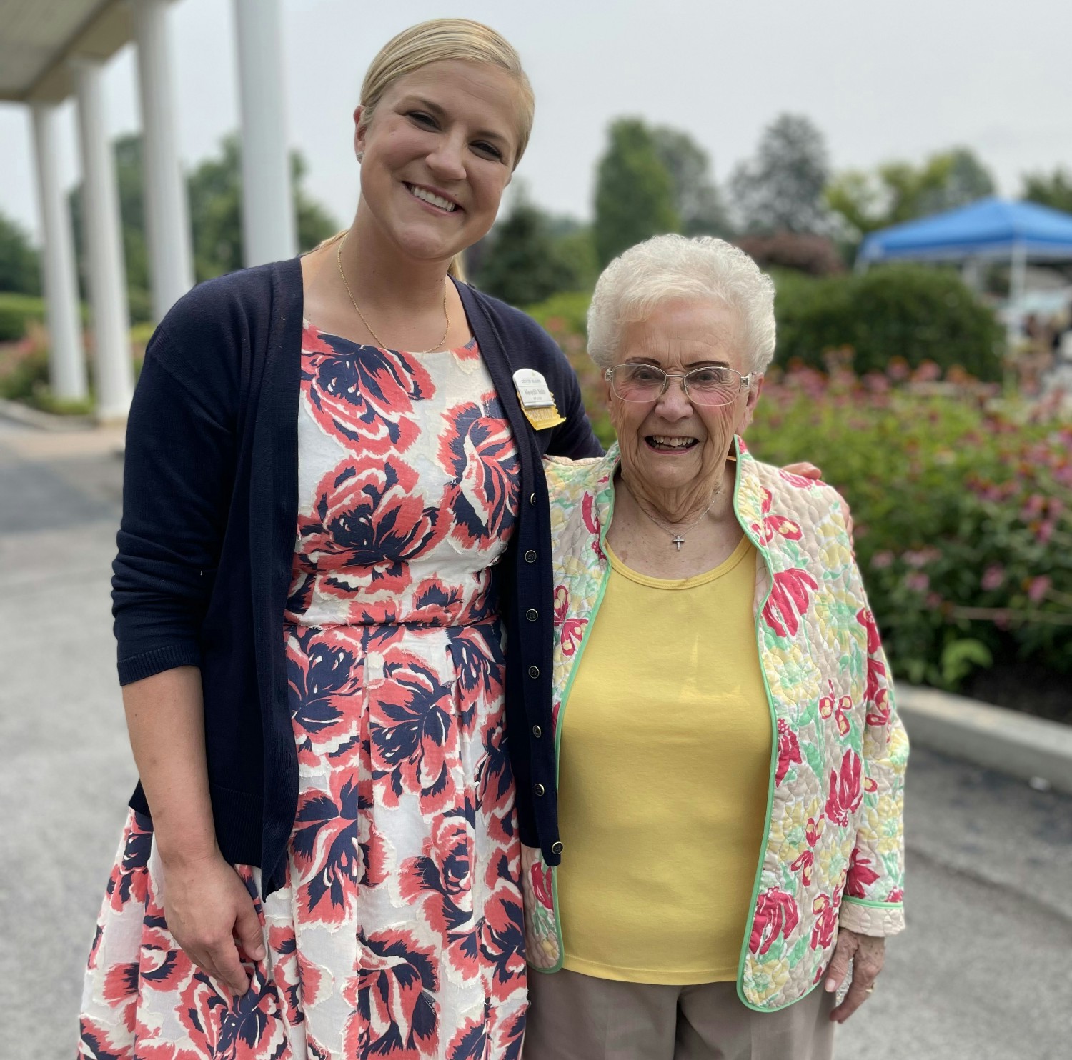Meredith Mills, President and CEO with one of our residents.