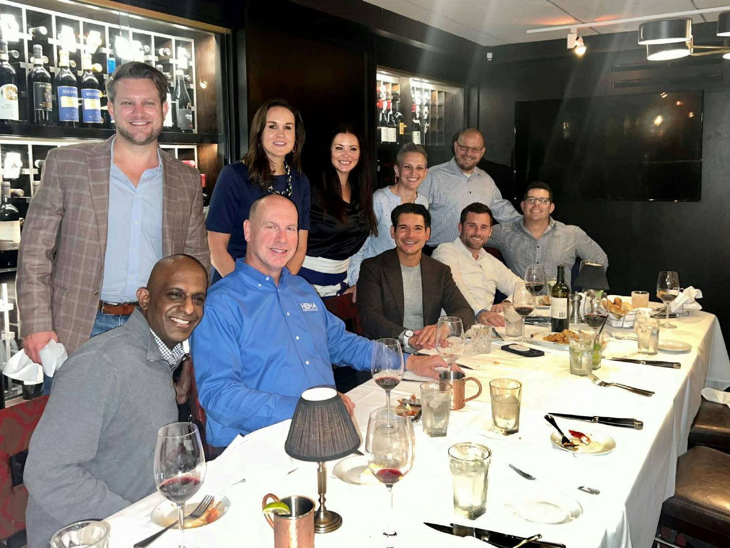 Kelly Spilios, VP of RCM Operations collaborating with industry professionals. 