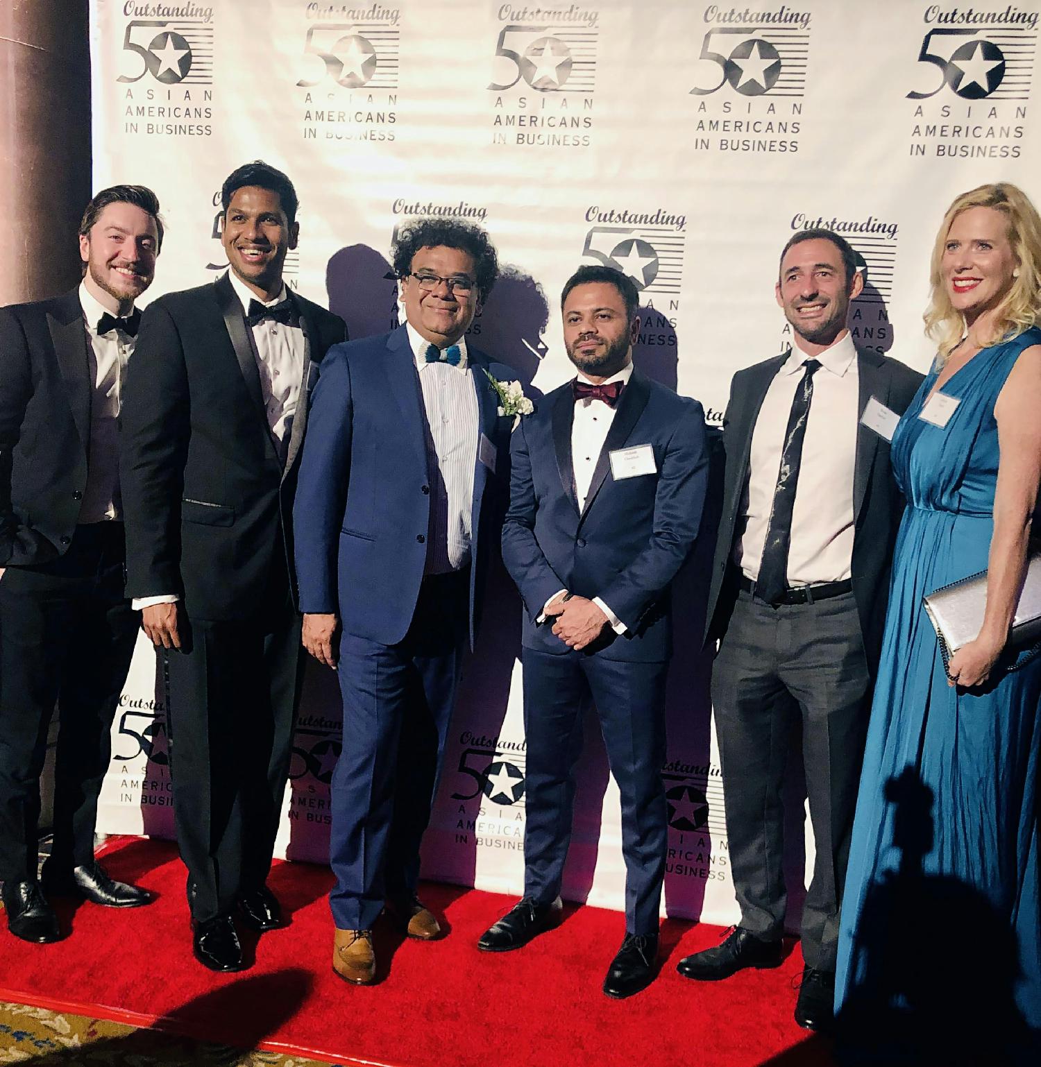 Reservations.com management celebrating Co-Founder Yatin Patel's receipt of an Outstanding 50 Asian Americans in Business award.