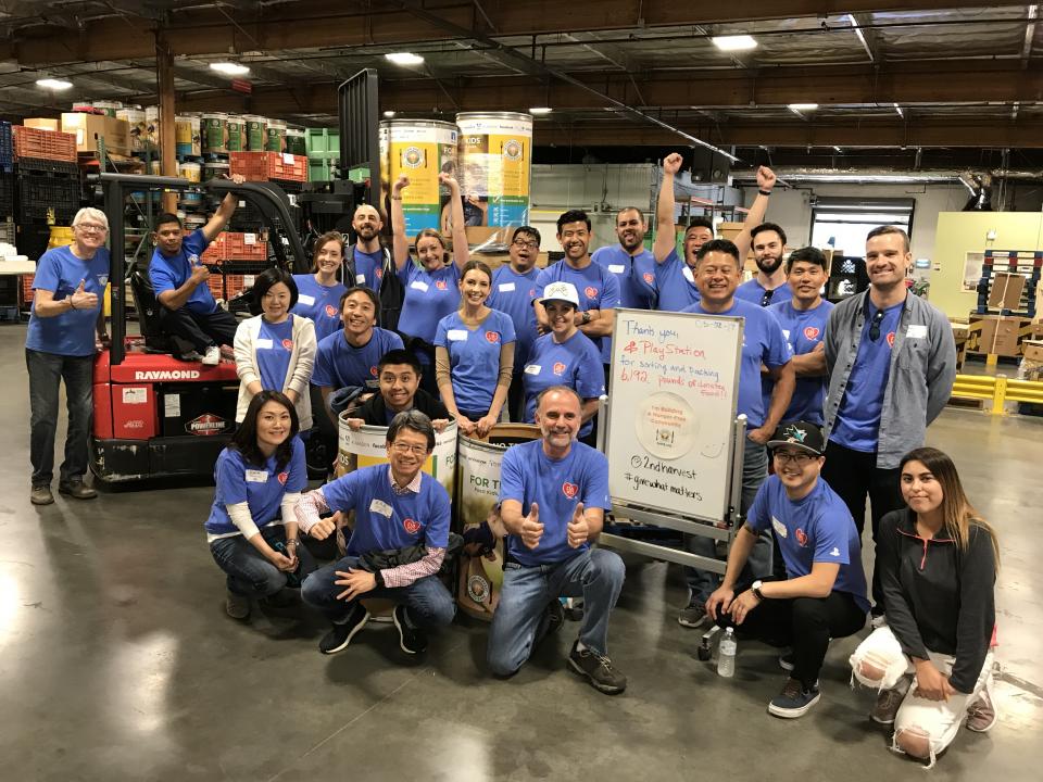Employees And Executives Volunteering At Second Harvest Food Bank