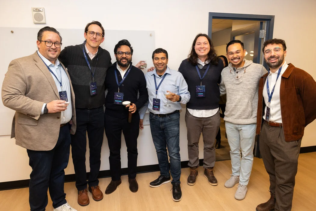 Members of the Acquis team enjoying each other's company at an event celebrating our recent office renovation.