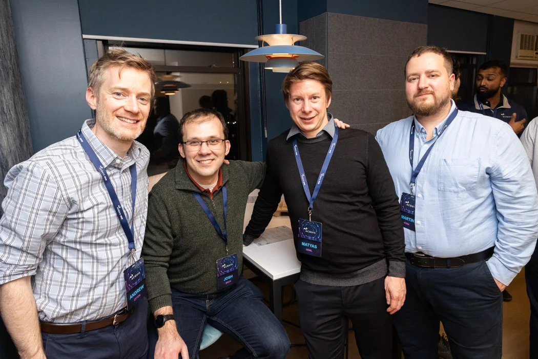 Members of the Acquis team enjoying each other's company at an event celebrating our recent office renovation.