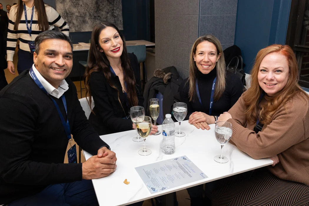 Members of the Acquis team enjoying each other's company at an event celebrating our recent office renovation.
